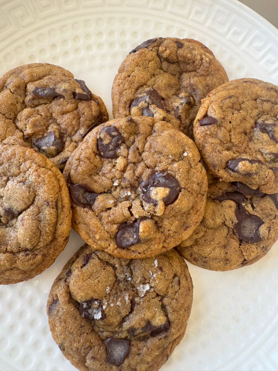Brown butter chocolate chip cookies on a white plate